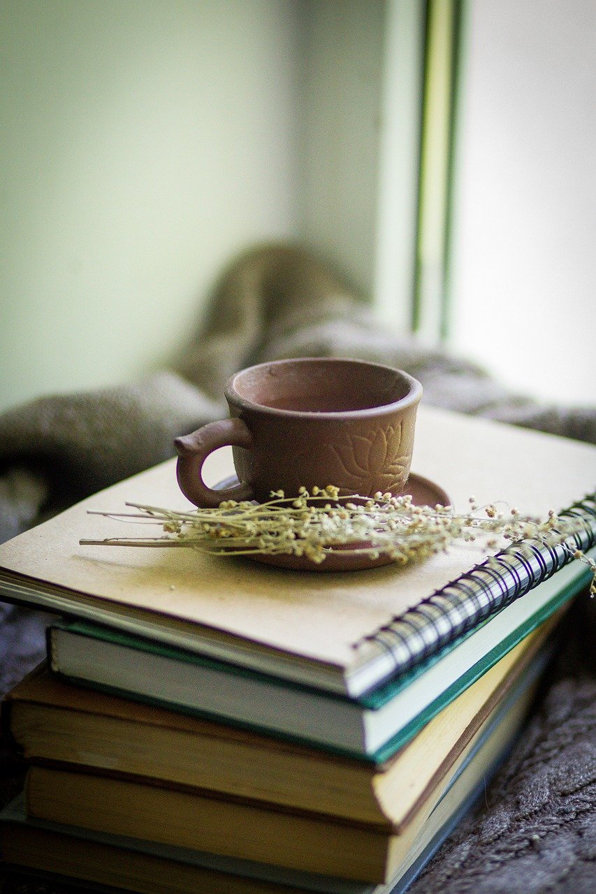 books, cup, herbs
