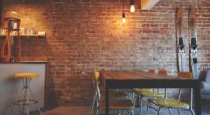 brown wooden dining table near white and brown mini bar