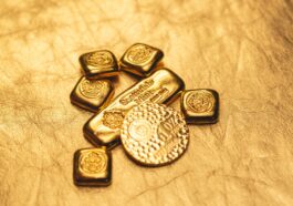 a bunch of gold bars sitting on top of a table