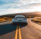 silver sports coupe on asphalt road